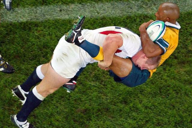 Mike Tindall sends Australias George Gregan flying with a tackle during the 2003 Rugby World Cup final. Picture: AP