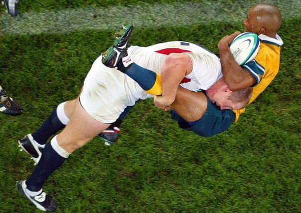 Mike Tindall sends Australias George Gregan flying with a tackle during the 2003 Rugby World Cup final. Picture: AP