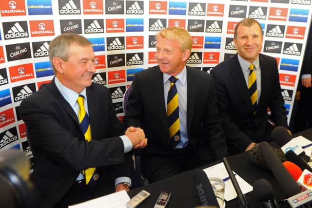 Gordon Strachan shakes hands with Campbell Ogilvie (SFA President) and right is Stewart Regan. Picture: Robert Perry