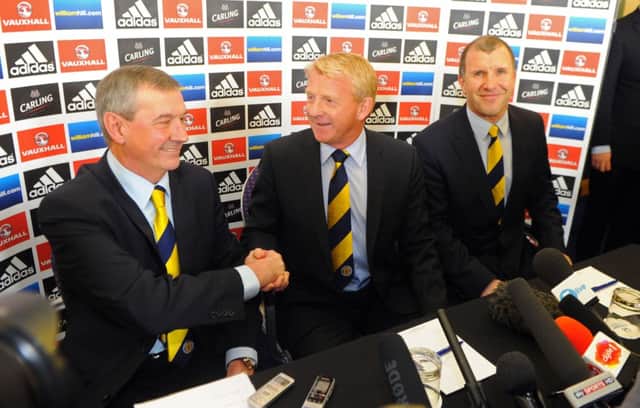 Gordon Strachan shakes hands with Campbell Ogilvie (SFA President) and right is Stewart Regan. Picture: Robert Perry