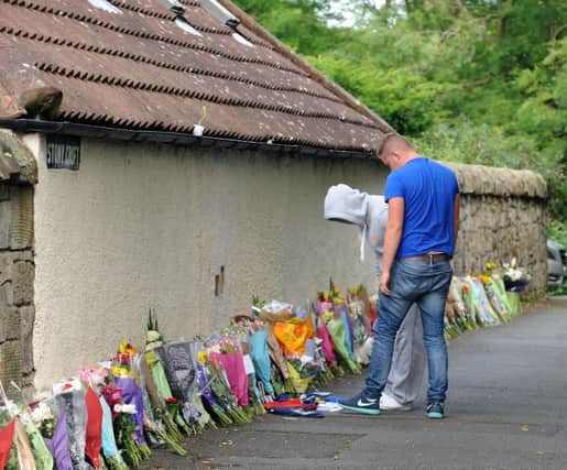 Floral tributes are left for Jordan Mackay who was stabbed in South Queensferry. Picture: Lisa Ferguson