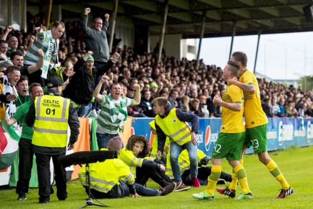 Callum McGregor celebrates scoring the only goal of the game in Reykjavik with his team-mate Mikael Lustig. Picture: SNS
