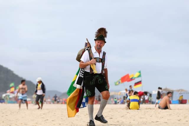 A German supporter strolls along Copacabana Beach. Picture: Getty