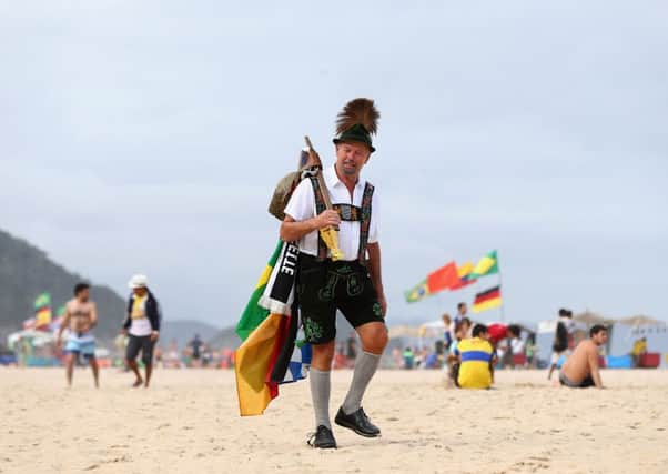 A German supporter strolls along Copacabana Beach. Picture: Getty