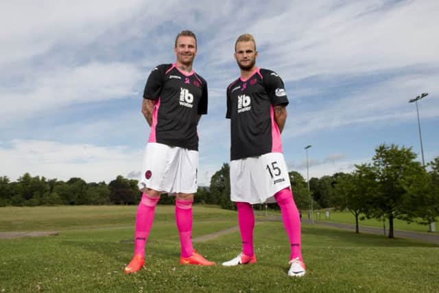 Ryan Stevenson and Kallum Higginbotham show off the new kit. Picture: SNS