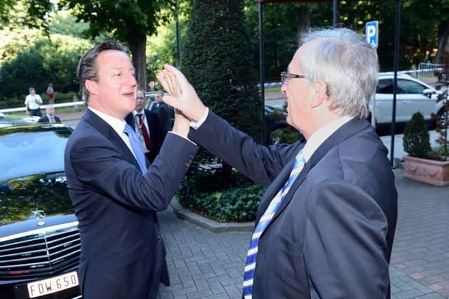 Mr Cameron and JeanClaude Juncker, whose EC appointment he fought against, enjoy a high five. Picture: PA