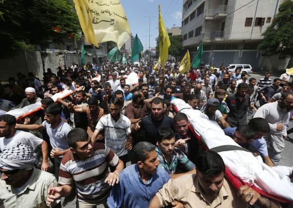 Palestinian mourners carry the bodies of four members of the al-Astal family, who were killed Wednesday by an Israeli airstrike. Picture: AP