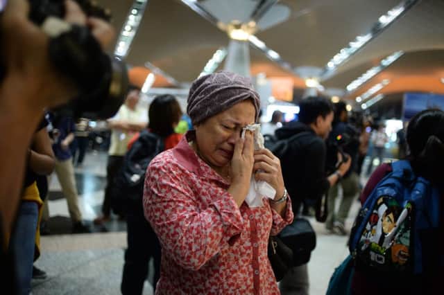 A woman reacts to news of the disaster at Kuala Lumpur International Airport. Picture: Reuters