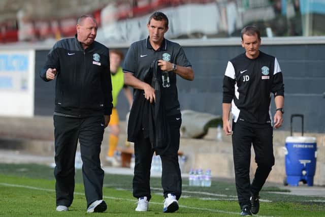 Andy Holden, left, has been confirmed as part of the Hibs backroom staff. Picture: Neil Hanna