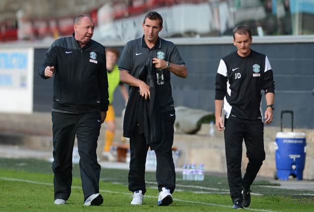 Andy Holden, left, has been confirmed as part of the Hibs backroom staff. Picture: Neil Hanna