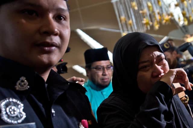 Relatives of passengers onboard MH17 in Kuala Lumpur International Airport. Picture: Getty