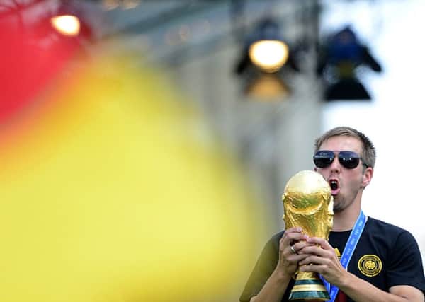 Germany's captain Philipp Lahm celebrates with the World Cup during a victory parade in Berlin. Picture: Getty