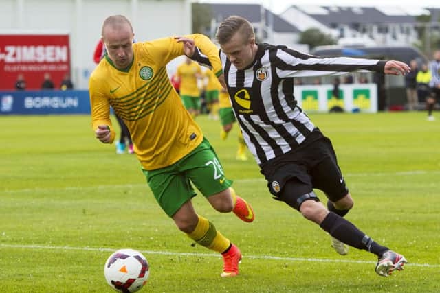 Celtic's Leigh Griffiths tussles with Gudmundur Reynir Gunnarsson. Picture: SNS