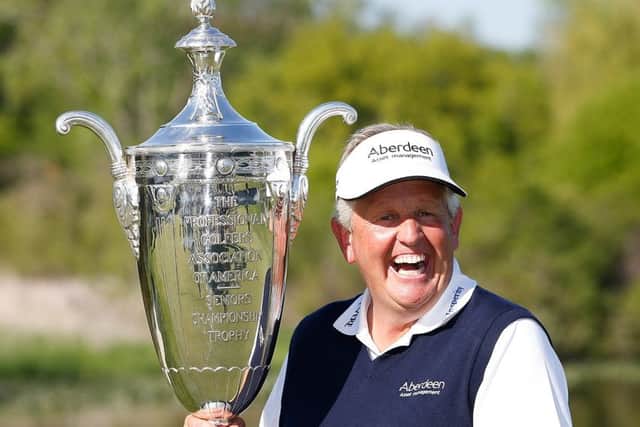 Colin Montgomerie lifts the Alfred S Bourne Trophy after winning his first 'major', the 2014 Senior PGA Championship at Benton Harbour, Michigan, in May. Picture: Getty