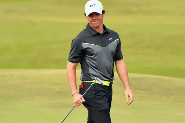 Rory McIlroy as he prepares to putt at the eighth hole yesterday. Picture: Getty