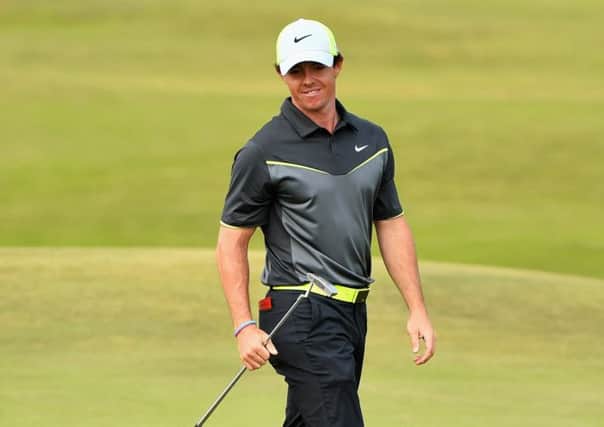 Rory McIlroy as he prepares to putt at the eighth hole yesterday. Picture: Getty