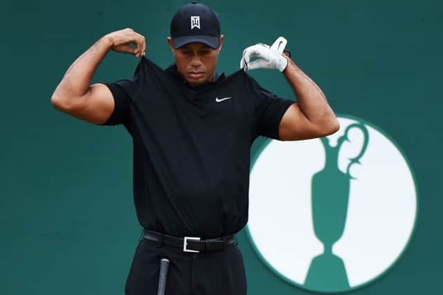 Tiger Woods looks to be feeling the heat at Hoylake yesterday when on another blisteringly hot day, the 14-time major winner had to sink a testing putt at the final hole to make the cut  his 77 leaving him 14 shots behind leader Rory McIlroy. Picture: Getty