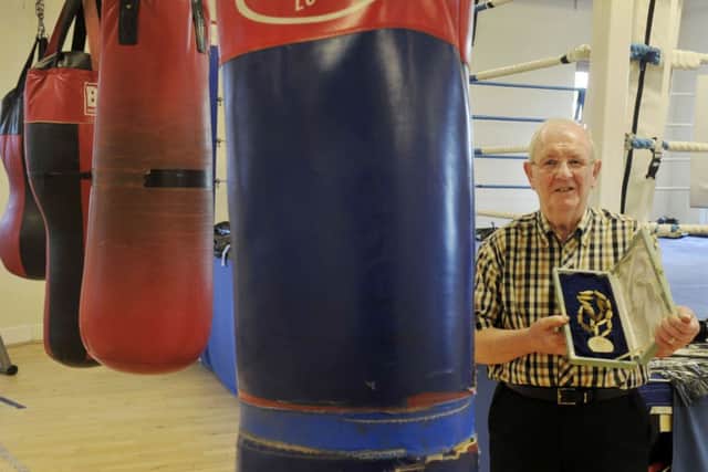 John McDermott displays his 1962 Commonwealth Games medal. Picture: Donald MacLeod