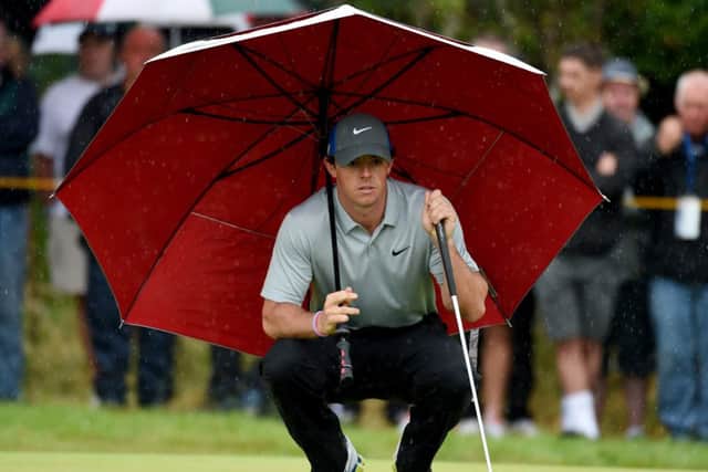 Rory McIlroy studies his putt on the fourth green at Royal Liverpool during his four-under-par 68 in the third round of the Open Championship yesterday. Picture: Ian Rutherford