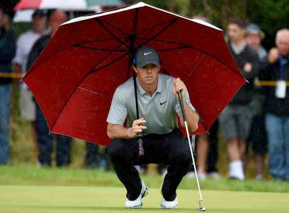 Rory McIlroy studies his putt on the fourth green at Royal Liverpool during his four-under-par 68 in the third round of the Open Championship yesterday. Picture: Ian Rutherford