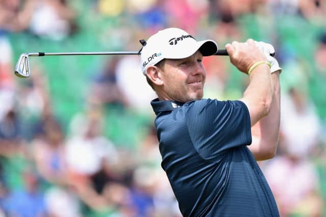 Stephen Gallacher tees off at the fourth yesterday on his way to a 68 and a 15th-place finish in The Open. Picture: Warren Little