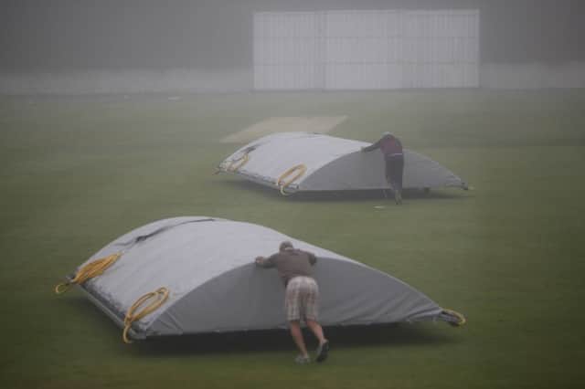 The covers go on as rain stops play at the Grange versus Falkland match at Raeburn Place on Saturday. Picture: Toby Williams