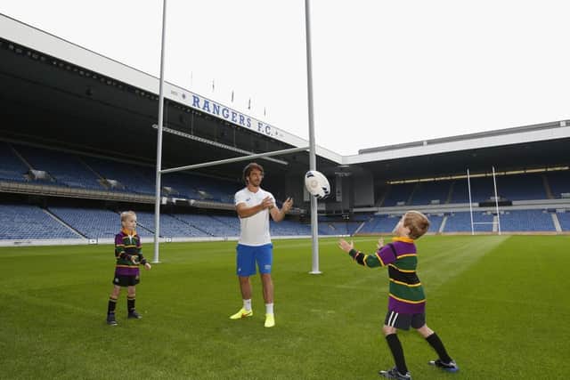 Adam Running and Sandy Heather join Scotland 7s captain Colin Gregor at Ibrox. Picture: Glasgow 2014/Getty