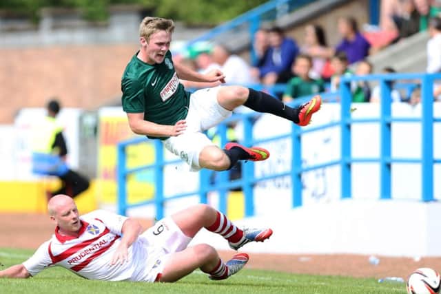 Hibs Lewis Allen flies through the air following a challenge by Chris Smith of Stirling Albion yesterday. Picture: Getty Images