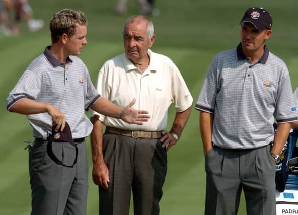 Bob Torrancc, centre, in deep discussion with Luke Donald, left, and Padraig Harrington, his star pupil. Picture: Ian Rutherford