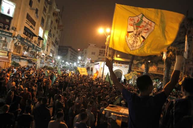 Palestinian celebrate after an Israeli soldier was reportedly captured. Picture: AFP/Getty