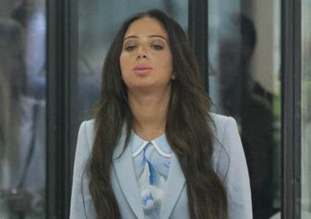 Tulisa Contostavlos looks visibly relieved before speaking to press. Picture: PA