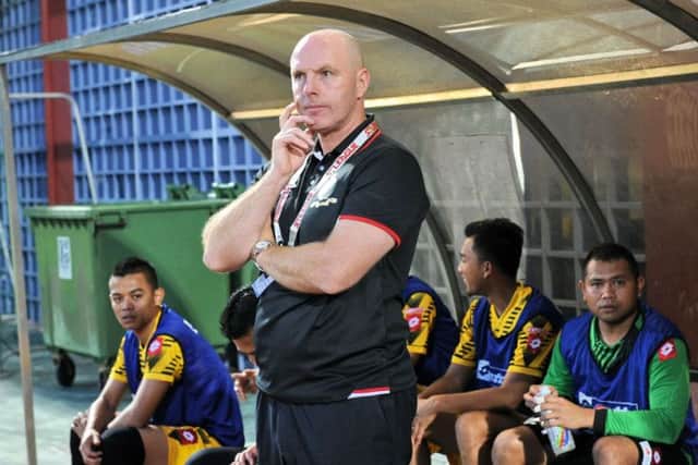 Steve Kean stands on the touchline during a DPMM match. The Brunei side are on course to win the title. Picture: Getty