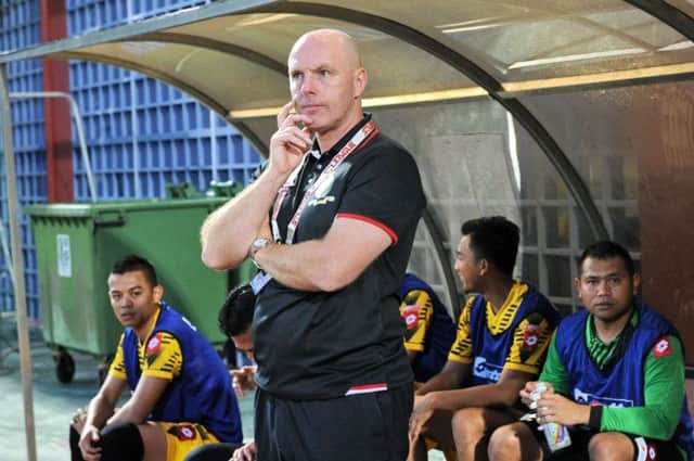 Steve Kean stands on the touchline during a DPMM match. The Brunei side are on course to win the title. Picture: Getty
