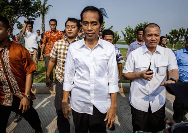 Joko Jokowi Widodo visits a reservoir yesterday near Jakarta. Picture: Getty