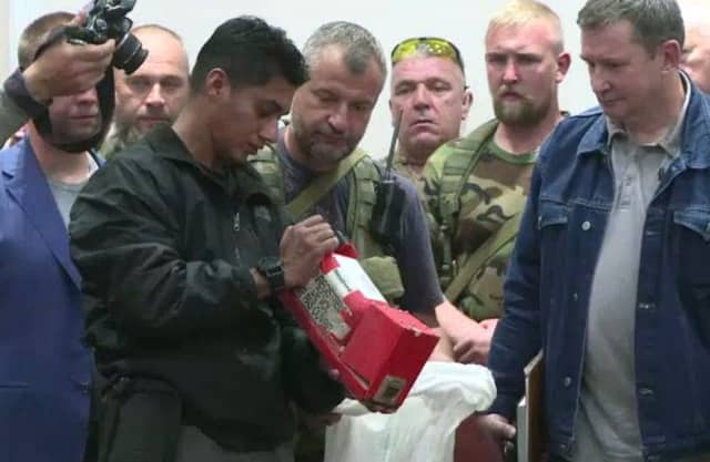 A Malaysian official checks one of the two black boxes recovered from the crash site. Picture: AFP/Getty Images
