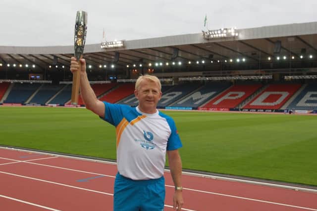 Gordon Strachan with the baton at Hampden. Picture: Getty Images