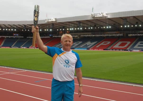 Gordon Strachan with the baton at Hampden. Picture: Getty Images