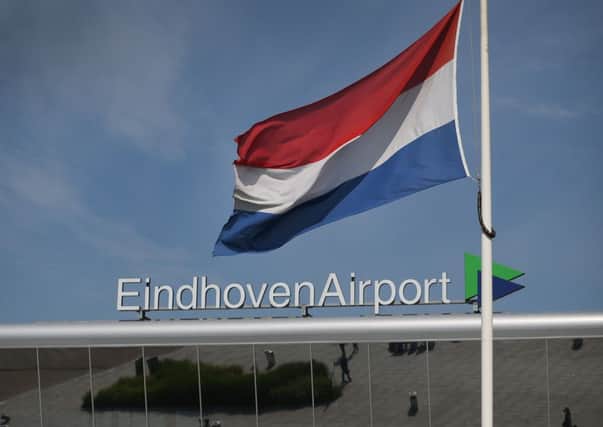A Dutch flag flies at half mast at Eindhoven Airport. Picture: Getty