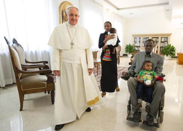 Meriam Ibrahim, centre, with baby Maya, husband Daniel, son Martin and Pope Francis. Picture: AP
