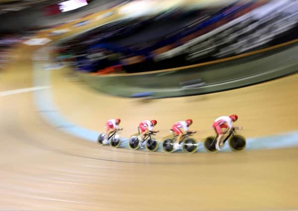 England's Bradley Wiggins, right, Andy Tennant, Ed Clancy and Steven Burke compete in the men's 4000m team pursuit qualifying round. Picture: Getty