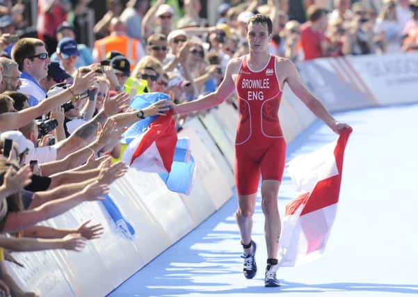 Alistair Brownlee celebrates his gold medal with the crowd. Picture: Greg Macvean