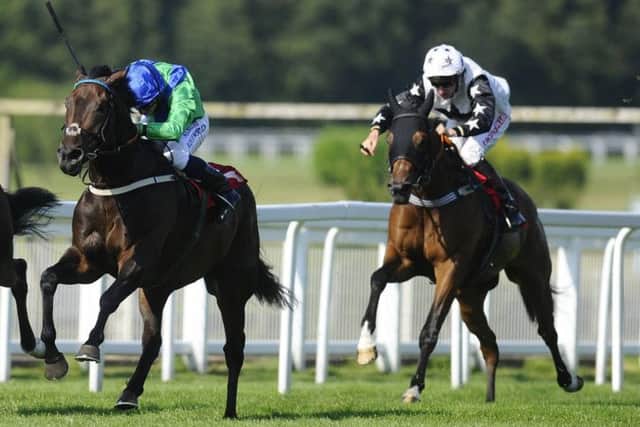 Jockey championship leader Ryan Moore completes his fourtimer on Global Leader, left, at Sandown Park. Picture: Alan Crowhurst/Getty