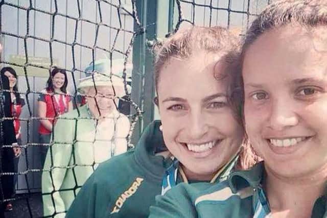 The Queen photobombs Jayde Taylor and her team-mate Brooke Peris. Picture: SWNS