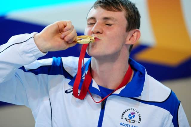 Ross Murdoch cant hide his joy at winning gold in the 200m breaststroke. Picture: Ian Rutherford