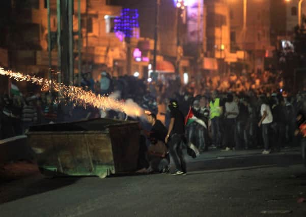 An estimated 10,000 Palestinians clashed with Israel security forces at the Qalandiya checkpoint between Ramallah and Jerusalem. Picture: Getty