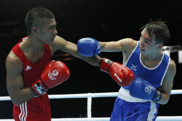 Michael Conlan of Northern Ireland, left, fights Matthew Martin from Nauru. Picture: AP