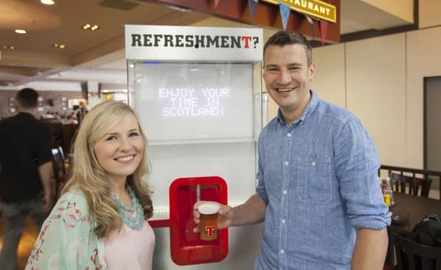Craig McGill and wife Zoe were the first to test their chat with the 'water cooler'. Picture: Business Wire