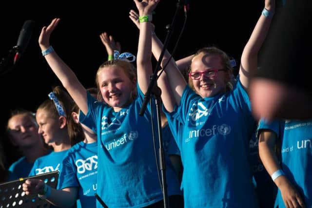 Children perform in aid of UNICEF as people soak up the atmosphere in the Live Zone on Glasgow Green. Picture: PA
