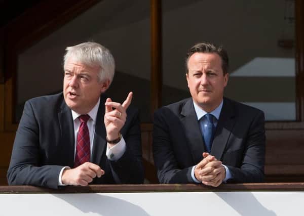 First Minister of the Welsh Assembly Carwyn Jonestalks with Prime Minister David Cameron. Picture: Alamy