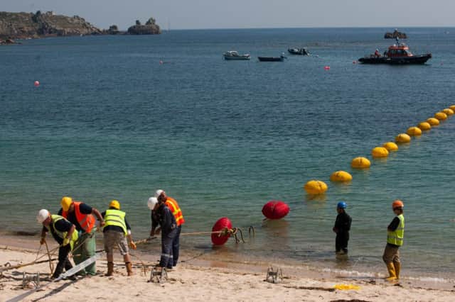 The cable is brought to shore off Porthcressa beach on the Isle of Scilly. Picture: SWNS